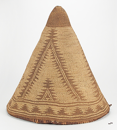 Tan, cone-shaped basket with triangular designs, made of roots, grass, splints, and vines
